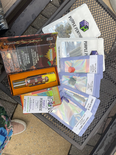 Purple Penthouse exterior view showcasing professional Cannabis store services in ,