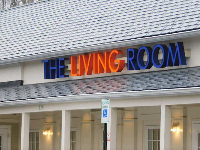 The Living Room exterior view showcasing professional Cannabis store services in Pikesville, Maryland